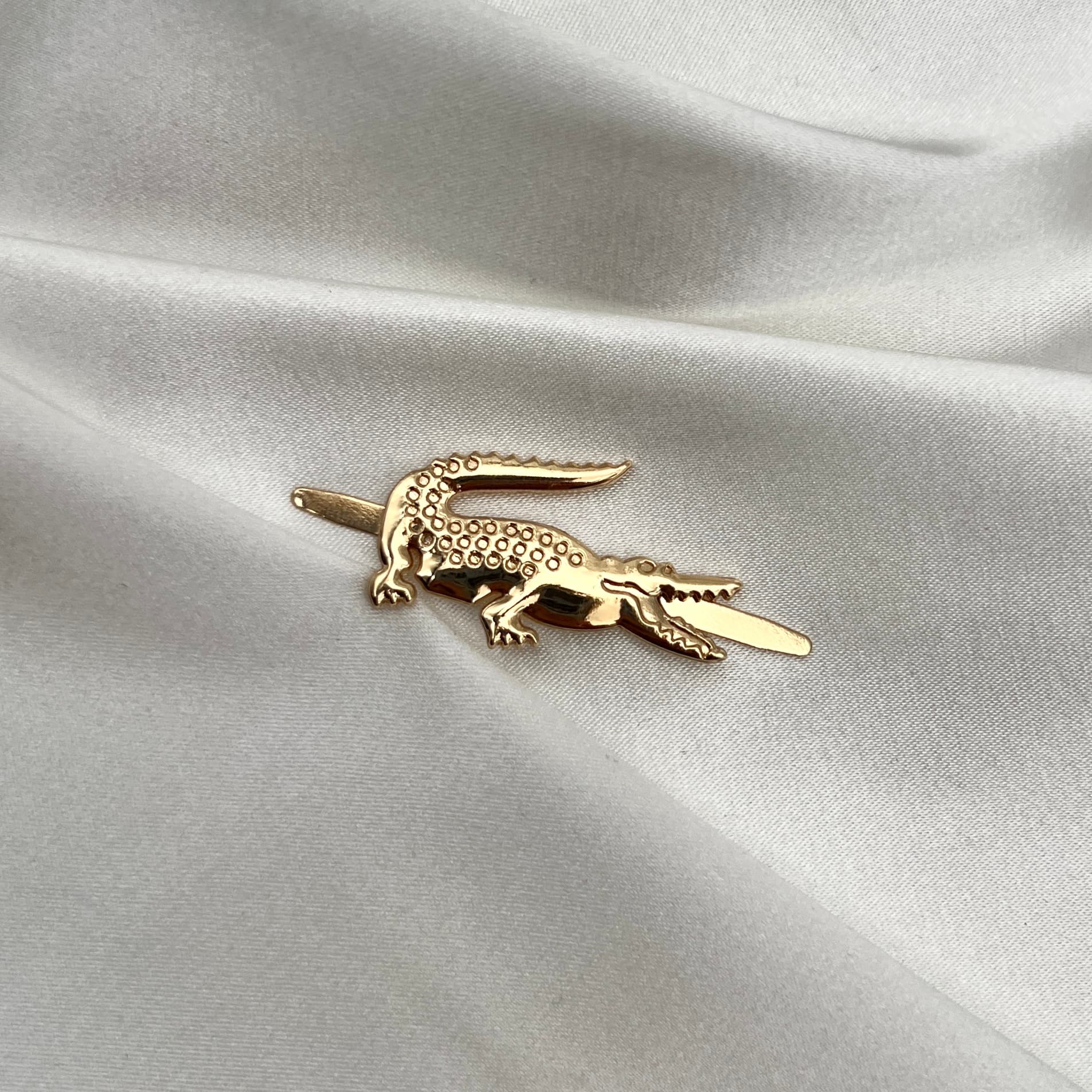 Motif de sac Lacoste Doré